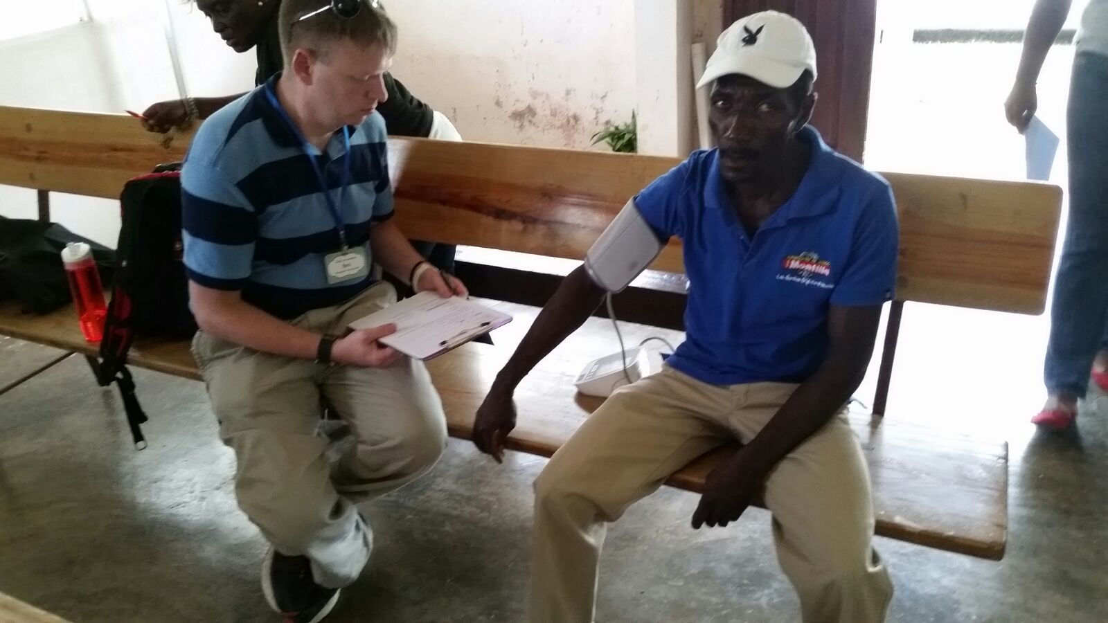 guy helping with blood pressure